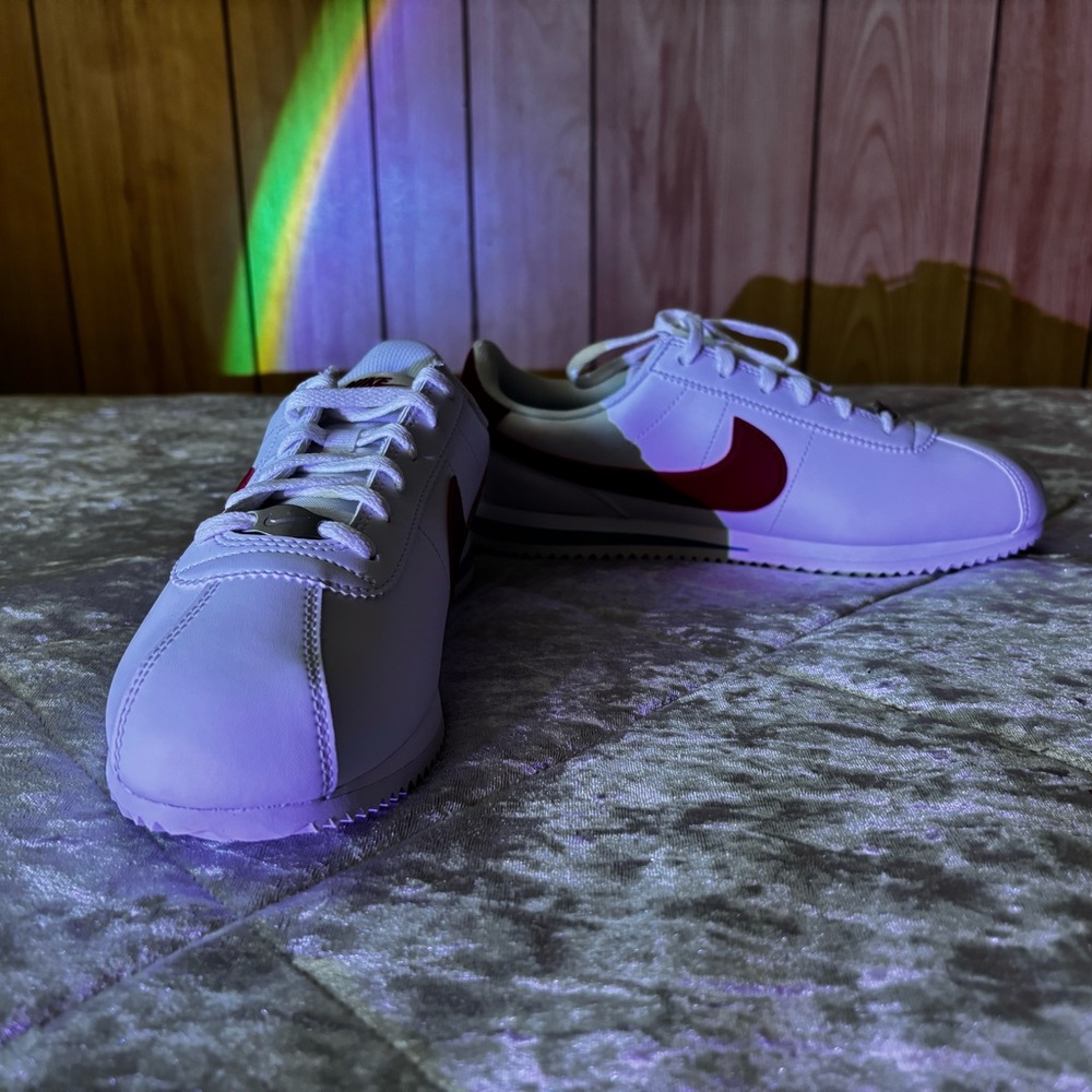 Women’s Nike Cortez white shoes w/ red swoosh and blue line